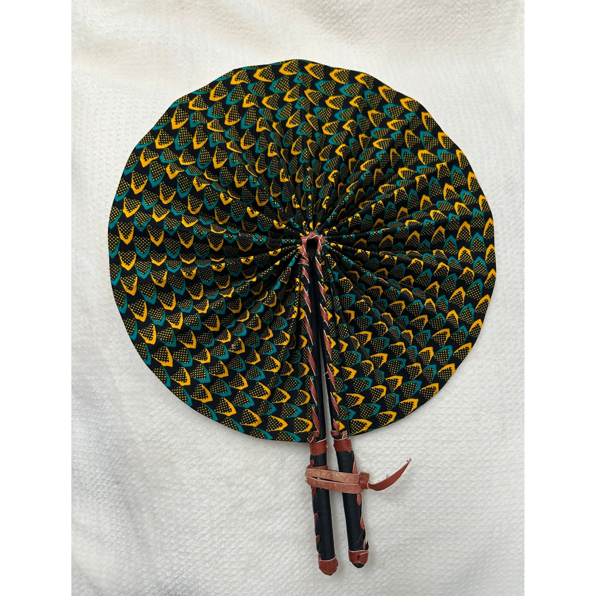 Blue and yellow tight patterned African print folding fan