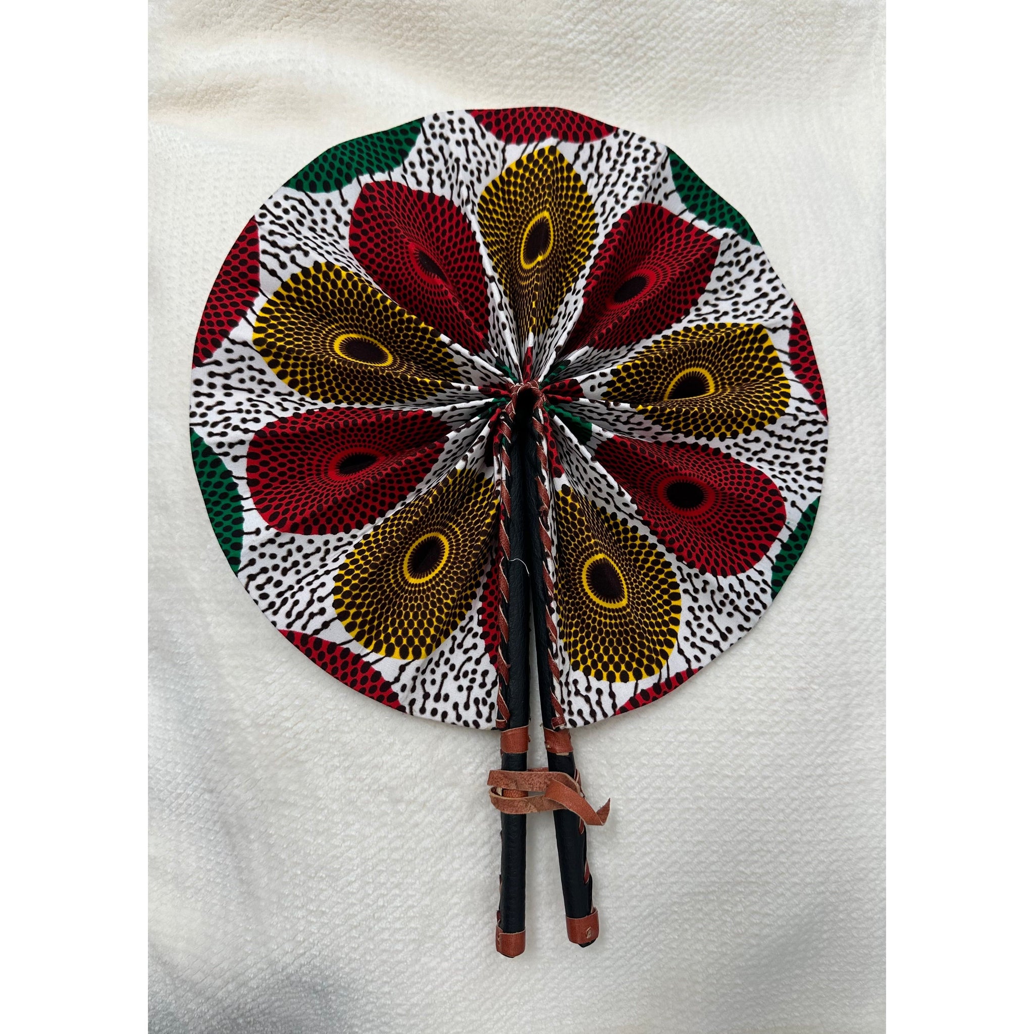 Red, green and yellow African print folding fan